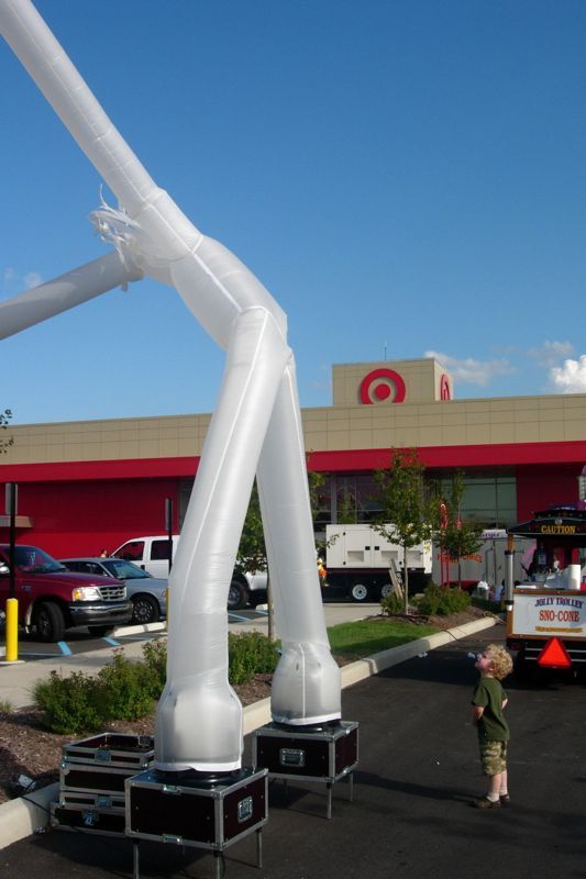 Boy looking at inflatable man